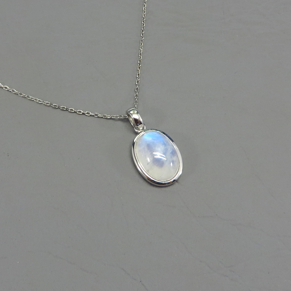 Oval Rainbow Moonstone Pendant Set in Sterling Silver
